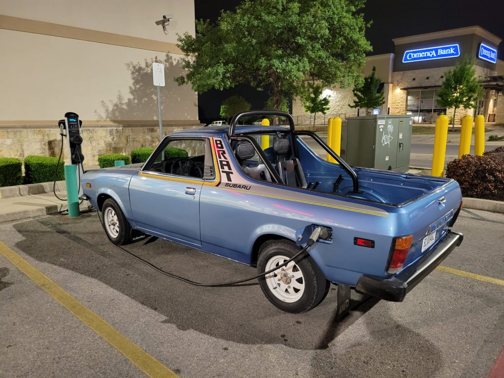 1980 Subaru EV Brat at public charging station